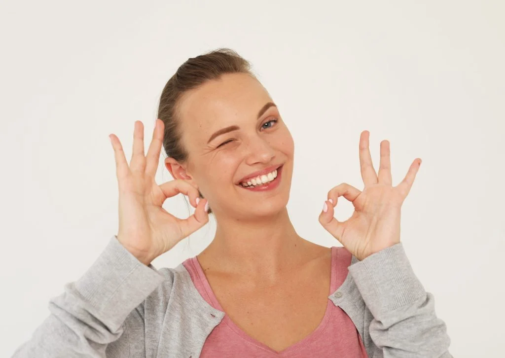 smiling woman showing her white teeth
